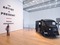 Entrance to the exhibition Marina Abramović: The Artist is Present, The Museum of Modern Art, 2010. Photo by Jason Mandella. In this photo: Marina Abramović and Ulay, Relation in Movement, 1977. Video (black and white, silent), sound environment (2010), Citroën Type H bus, fourteen black-and-white photographs, and megaphone 34:50 min. Musée d’Art Contemporain de Lyon; video and sound environment courtesy the artist and Sean Kelly Gallery. © 2010 Marina Abramović. Courtesy the artist and Sean Kelly Gallery/Artists Rights Society (ARS), New York