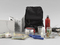  Rirkrit Tiravanija. <i>Untitled (Rucksack Installation)</i>. 1993. Multiple of backpack, map, camping stove, dishes, can opener, and ingredients for a Thai rice meal rucksack (approx.): 15 3/4 x 12 5/8 x 11 7/16" (40 x 32 x 29cm); sheet (map): 76 5/16 x 68 1/8" (193.9 x 173 cm). The Museum of Modern Art. Purchased with funds given by Linda Barth Goldstein.