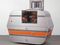 Andrea Zittel, A-Z Escape Vehicle: Customized by Andrea Zittel, 1996. Exterior: steel, insulation, wood and glass. Interior: colored lights, water, fiberglass, wood, papier-mâché, pebbles and paint, 62" x 7' x 40" (157.5 x 213.3 x 101.6 cm). The Norman and Rosita Winston Foundation, Inc. Fund and an anonymous fund. © 2012 Andrea Zittel. 