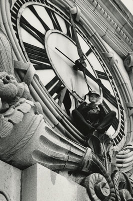 Gordon Matta-Clark posing for the camera during his performance Clockshower. Photographer unknown. 1973 [III.A.1] 