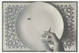 Hand with Cigarette, Pea on Plate Placemat