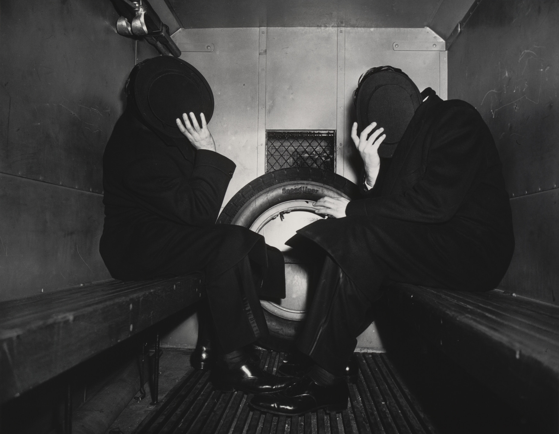 Weegee (Arthur Fellig). Charles Sodokoff and Arthur Webber Use Their Top Hats to Hide Their Faces. 1942