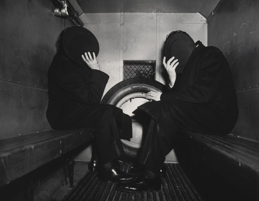 Weegee (Arthur Fellig). Charles Sodokoff and Arthur Webber Use Their Top Hats to Hide Their Faces. 1942