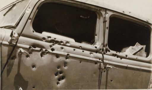 Unidentified photographer. "Car in which Clyde Barrow and Bonnie Parker Were Riddled with Bullets". 1934