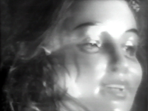 The image is a high contrast, black and white close-up of a person's face, with a slight blur effect. The person’s facial features, including eyes, nose, and slightly open mouth, are visible. This is an AI generated description. To give feedback, email ai@moma.org.