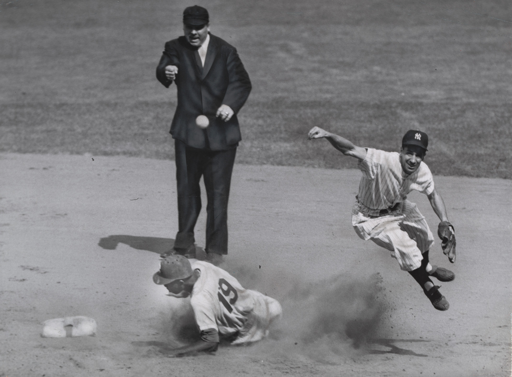 Ernie Sisto/The New York Times. World Series: Yankees vs. Dodgers (Gilliam slides into second). September 28, 1955