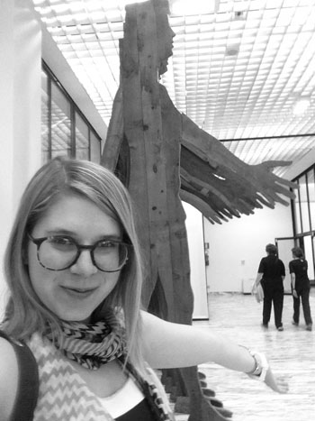 Follow me to the museum! The author, at the Galleria Civica d’Arte Moderna e Contemporanea in Turin, with Mario Ceroli’s <i>La Grande Cina (Greater China)</i> (1968) in the background
