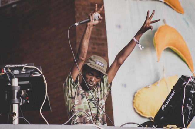 DJ Spoko feeling the love from the crowd. MoMA PS1 Warm Up, Saturday, June 28, 2014. Photo: Charles Roussell
