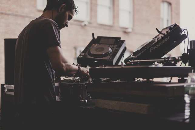 Young Male of White Material starting the day off with a DJ set. MoMA PS1 Warm Up, Saturday, July 19, 2014. Photo: Charles Roussel