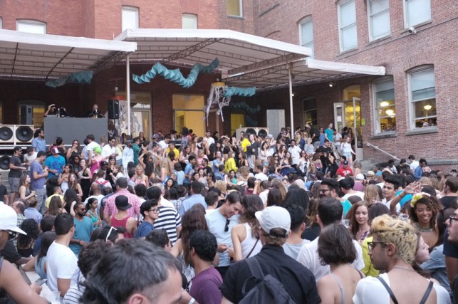 The crowd gets ready for an afternoon of dancing under the Chen Chen & Kai Williams installation. MoMA PS1 Warm Up, Saturday, August 16, 2014. Photo: Manuela Paz