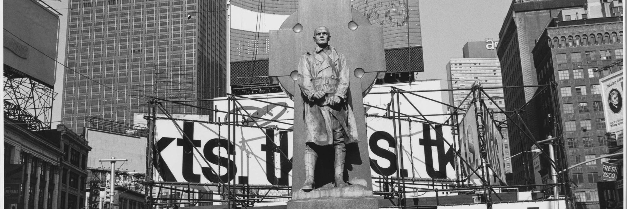 Lee Friedlander. Father Duffy. Times Square, New York City. 1974. Gelatin silver print, 71/2 × 11 1/4″ (19.1 × 28.5 cm). The Museum of Modern Art, New York. Purchase. © 2005 Lee Friedlander