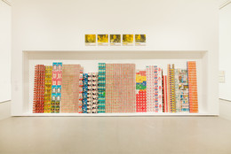 George Maciunas. One Year. 1973–74. Various empty containers and packaging. Above: Alison Knowles. Selections from The Identical Lunch. 1969. Screenprints on canvas. Installation view of both works at MoMA. The Museum of Modern Art, New York. The Gilbert and Lila Silverman Fluxus Collection. Photo: Jason Mandella