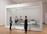 David Lamelas. Office of Information about the Vietnam War at Three Levels: The Visual Image, Text and Audio. 1968/2015. Office furniture, telex, tape recorder, microphone, telephone receivers, text, Plexiglas partition, and performance. The Museum of Modern Art, New York. Gift of the artist and Jan Mot, Brussels. © 2015 David Lamelas. Performance view, Transmissions: Art in Eastern Europe and Latin America, 1960–1980, The Museum of Modern Art, September 5, 2015–January 3, 2016. Performer: Patrisa Tomassini. Digital image © 2015 The Museum of Modern Art. Photo: Thomas Griesel