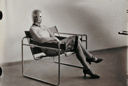 Erich Consemüller. Untitled (Woman [Lis Beyer or Ise Gropius] in B3 club chair by Marcel Breuer wearing a mask by Oskar Schlemmer and a dress in fabric designed by Beyer). c. 1926. Gelatin silver print. Private collection