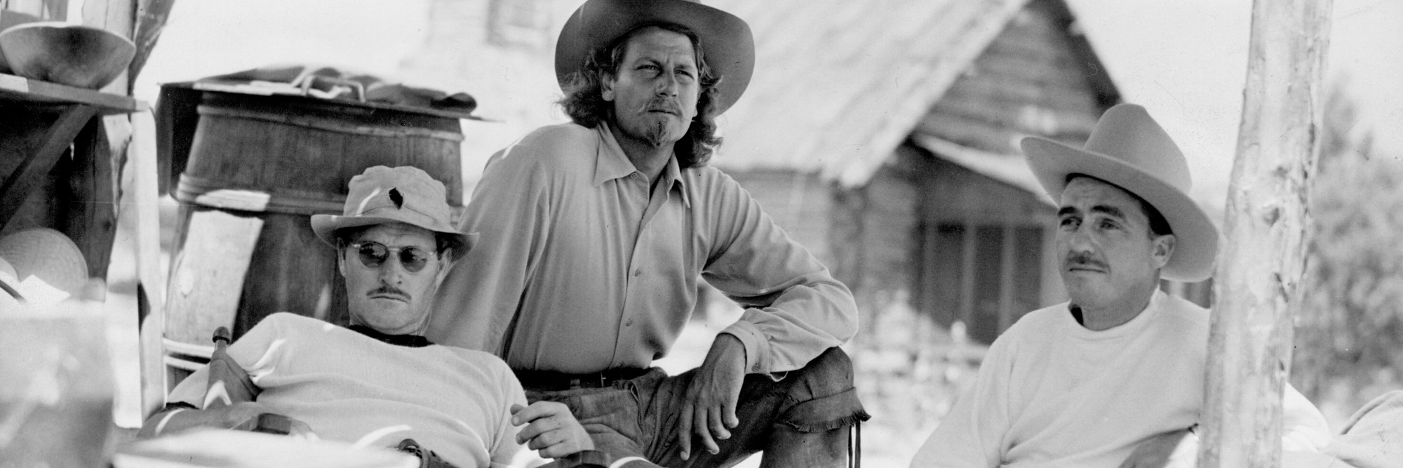 William Wellman, Joel McRea, and editor James B. Clark on the set of Buffalo Bill. 1944. USA. Directed by William A. Wellman. © Twentieth Century Fox