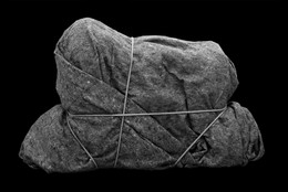 Henrik Olesen. Imitation/Enigma (2). 2008. Box, adhesive tape, rope, padding material, and blanket, 23 5/8 x 39 3/8 x 11 13/16" (60 x 100 x 30 cm). © Henrik Olesen. Courtesy the artist and Galerie Daniel Buchholz, Cologne and Berlin