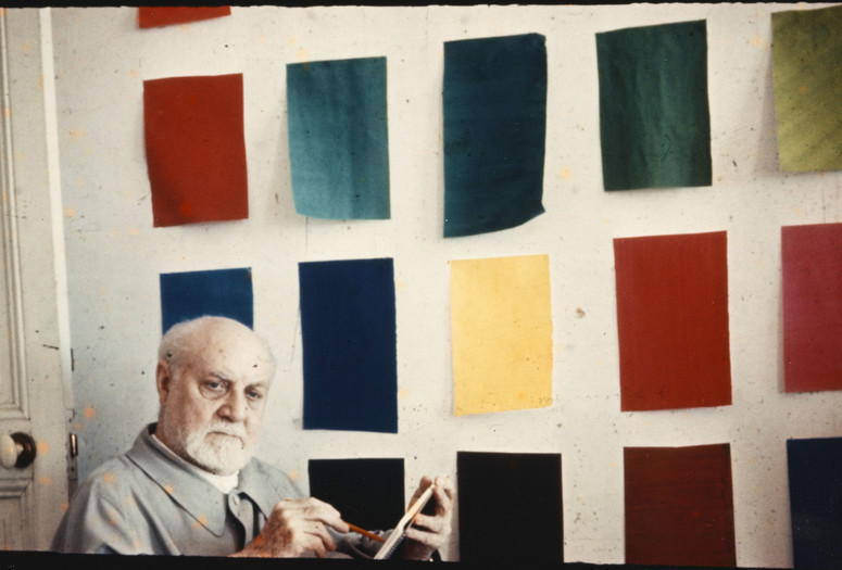 Matisse in front of gouache-painted papers, Hôtel Régina, Nice. Photo: Lydia Delectorskaya. © 2014 Succession H. Matisse