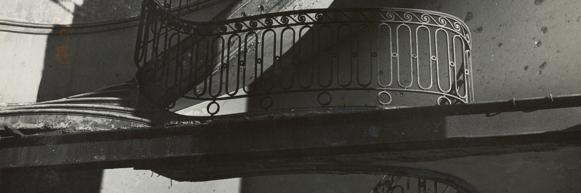Bill Brandt. Bombed Regency Staircase, Upper Brook Street, Mayfair. c. 1942. Gelatin silver print, 9 × 7 5/8″ (22.8 × 19.4 cm). Acquired through the generosity of Clarissa A. Bronfman