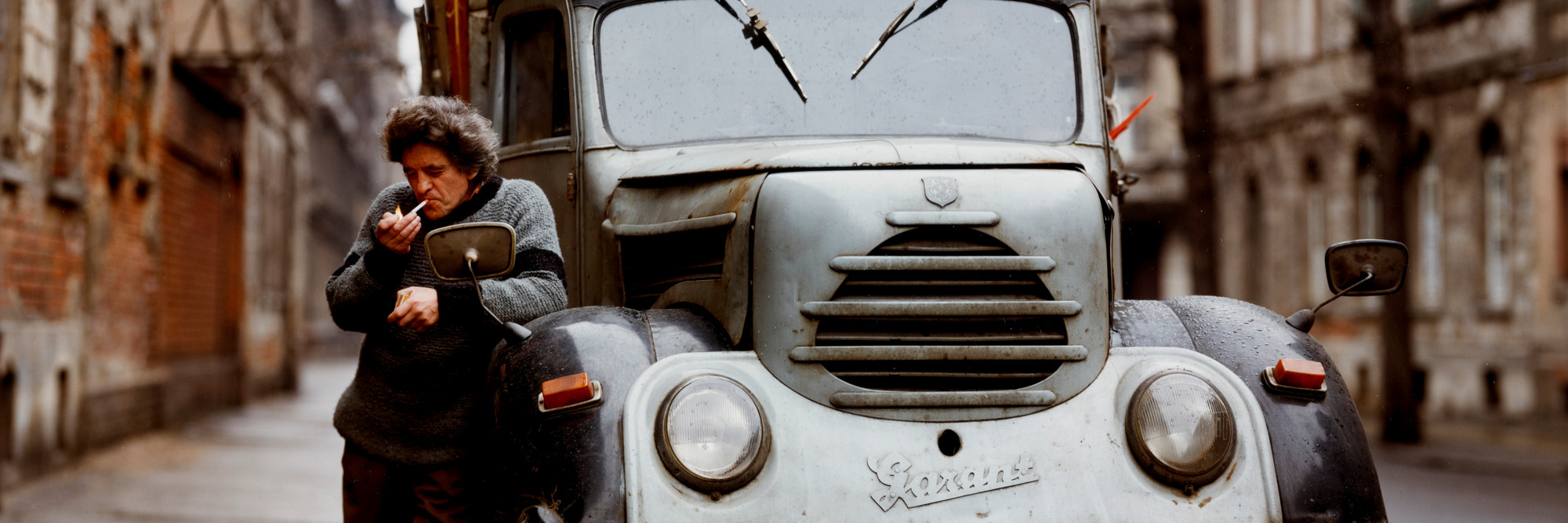 Eberhard Grames (German, b. 1953). Man with His Truck, East Germany. 1990. Chromogenic color print, 15 3/4 × 19 3/4ʺ (40 × 50.2 cm). Horace W. Goldsmith Fund through Robert B. Menschel. © 2016 Ebergard Grames