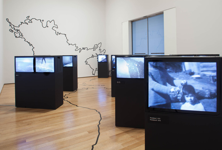 Credit: Juan Downey. Video Trans Americas. 1973–76. Fourteen-channel video (black and white, sound; duration variable) and vinyl map. Installation view, Transmissions: Art in Eastern Europe and Latin America, 1960–1980, The Museum of Modern Art, New York, September 5, 2015–January 3, 2016. Acquired through the generosity of the Latin American and Caribbean Fund and Baryn Futa in honor of Barbara London. © 2015 Estate of Juan Downey &amp; Marilys B. Downey. Digital image © 2015 The Museum of Modern Art. Photo: Thomas Griesel