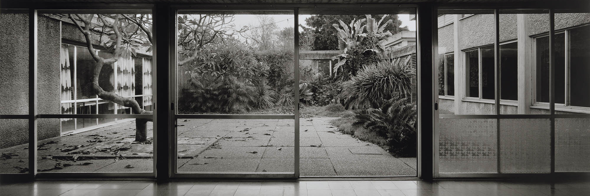 Gabriele Basilico. Kibbutz Kfar Masaryk, Israel. 1994. Courtyard of the dining hall designed by Munio Gitai Weinraub, 1962–63. Pigmented inkjet print, 31½ × 63″ (80 × 160 cm). The Museum of Modern Art, New York. Gift of Studio Gabriele Basilico