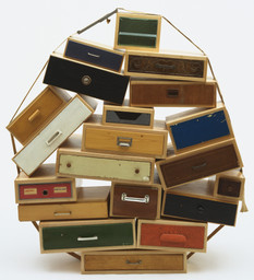 Tejo Remy. You Can’t Lay Down Your Memory Chest of Drawers. 1991. Metal, paper, plastic, burlap, contact paper and paint, 55.5 × 53 × 20″ (141 × 134.6 × 50.8 cm). Manufactured by Tejo Remy for Droog Design, the Netherlands. Frederieke Taylor Purchase Fund