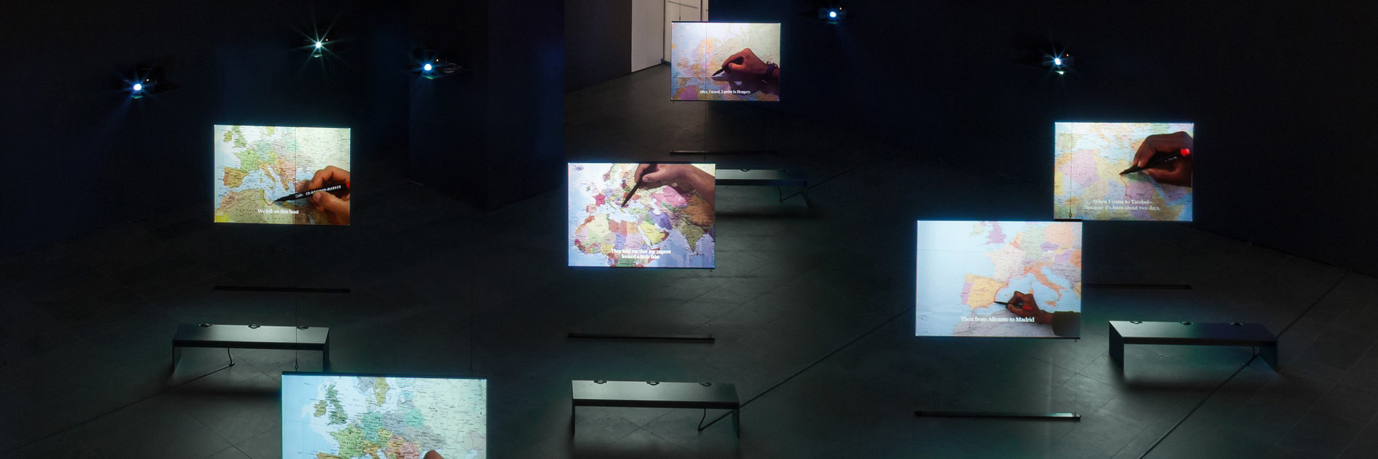 Bouchra Khalili. The Mapping Journey Project. 2008–11. Eight-channel video (color, sound). Installation view, Bouchra Khalili: The Mapping Journey Project, The Museum of Modern Art, New York, April 9–August 28, 2016. The Museum of Modern Art, New York. Fund for the Twenty First Century, 2014. © 2016 Bouchra Khalili. Digital image © 2016 The Museum of Modern Art. Photo: Jonathan Muzikar