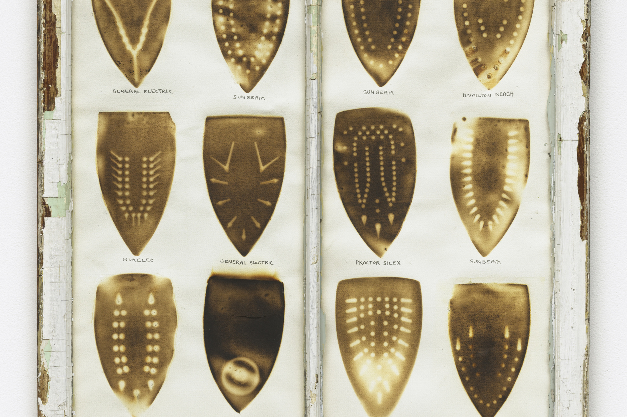 Willie Cole. Domestic I.D. IV. 1992. Iron scorches and pencil on paper mounted in recycled painted wooden window frame, 35 × 32 × 1 1/8″ (88.9 × 81.3 × 3.4 cm). The Museum of Modern Art, New York. Purchased with funds given by Agnes Gund