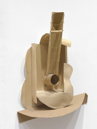 Pablo Picasso. Still life with Guitar. Variant state. Paris, assembled before November 15, 1913. Subsequently preserved by the artist. Paperboard, paper, string, and painted wire installed with cut cardboard box, Overall: 30 × 20 1/2 × 7 3/4″ (76.2 × 52.1 × 19.7cm). The Museum of Modern Art, New York. Gift of the artist. © 2016 Estate of Pablo Picasso / Artists Rights Society (ARS), New York