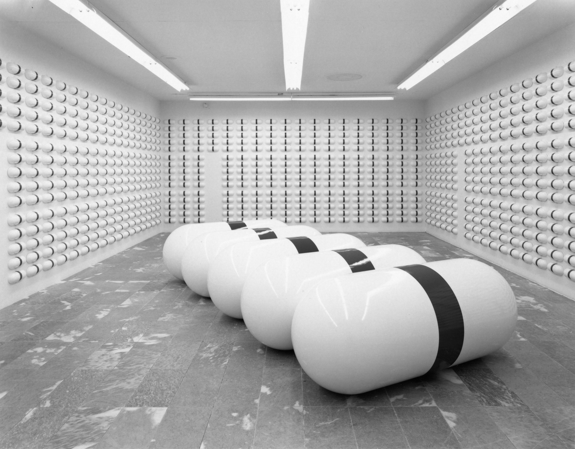General Idea. One Day of AZT and One Year of AZT. 1991. Five units of fiberglass, each 33 7/16″ × 84 1⁄8 × 33 7/16″; 1,825 units of vacuum-formed polystyrene with vinyl, each 4 7⁄8 × 12 3⁄8 × 3″. Collection National Gallery of Canada, Ottawa. Installation view at The Museum of Modern Art, New York. Photo: Erik Landsberg