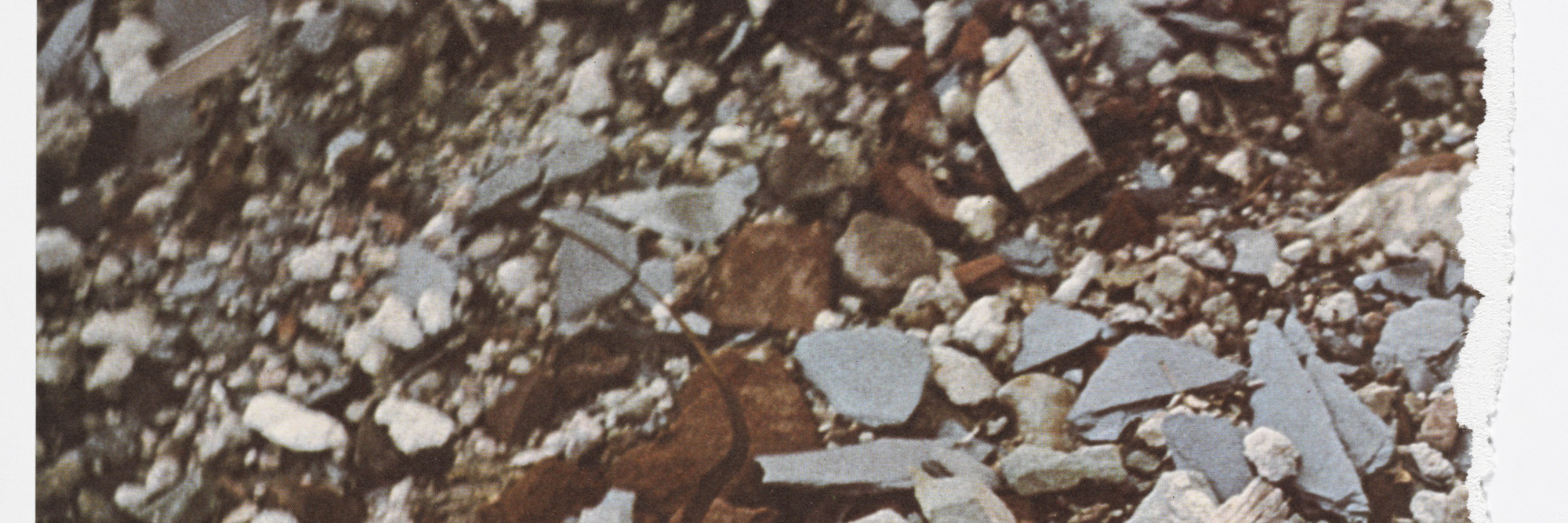 Robert Smithson. Torn Photograph from the 2nd Stop (Rubble) (2nd Mountain of Six Stops on a Section) from Artists &amp; Photographs. 1970. Offset lithograph, torn into four pieces from a portfolio of nineteen printed objects (including box cover), ea. approx. sheet 10 7/8 × 11″ (27.6 × 28 cm). Gift of Kynaston McShine
