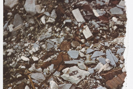 Robert Smithson. Torn Photograph from the 2nd Stop (Rubble) (2nd Mountain of Six Stops on a Section) from Artists &amp; Photographs. 1970. Offset lithograph, torn into four pieces from a portfolio of nineteen printed objects (including box cover), ea. approx. sheet 10 7/8 × 11″ (27.6 × 28 cm). Gift of Kynaston McShine