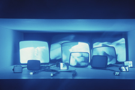 Gary Hill. Inasmuch As It Is Always Already Taking Place. 1990. Sixteen-channel video (black and white, sound), 16 black and white TV tubes and wires. Recessed in a wall 42″ (106.7 cm) from the floor, overall 16 × 53 3/4 × 68″ (40.6 × 136.5 × 172.7 cm). Gift of Agnes Gund, Marcia Riklis, Barbara Wise, Margot Ernst and purchase. © 1990 Gary Hill. Installation view of Video Spaces: Eight Installations at The Museum of Modern Art, New York