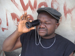 Nollywood Babylon. 2008. Canada/Nigeria. Written, directed, and photographed by Ben Addelman, Samir Mallal. Pictured: Lancelot prepares to take a shot. Photo: Samir Mallal. © 2008 National Film Board of Canada. All rights reserved