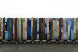 Yin Xiuzhen. Collective Subconscious. 2007. Minibus, stainless steel, used clothes, stools, music. Collection of the artist. © 2010 Yin Xiuzhen