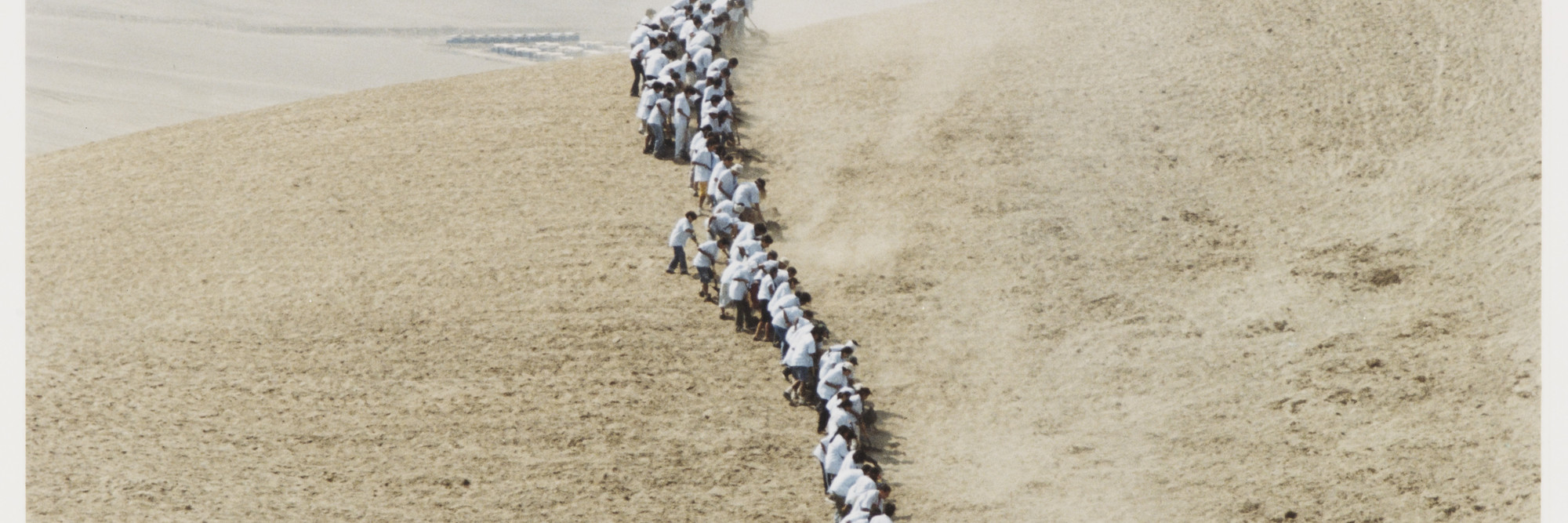 Francis Alÿs. Untitled, from When Faith Moves Mountains. 2002. Color photograph. The Museum of Modern Art, New York. Gift of The Speyer Family Foundation, Kathy and Richard S. Fuld, Jr., Marie-Josée and Henry R. Kravis, Patricia Phelps de Cisneros, Anna Marie and Robert F. Shapiro, The Julia Stoschek Foundation, Düsseldorf, and Committee on Media Funds. © 2011 Francis Alÿs