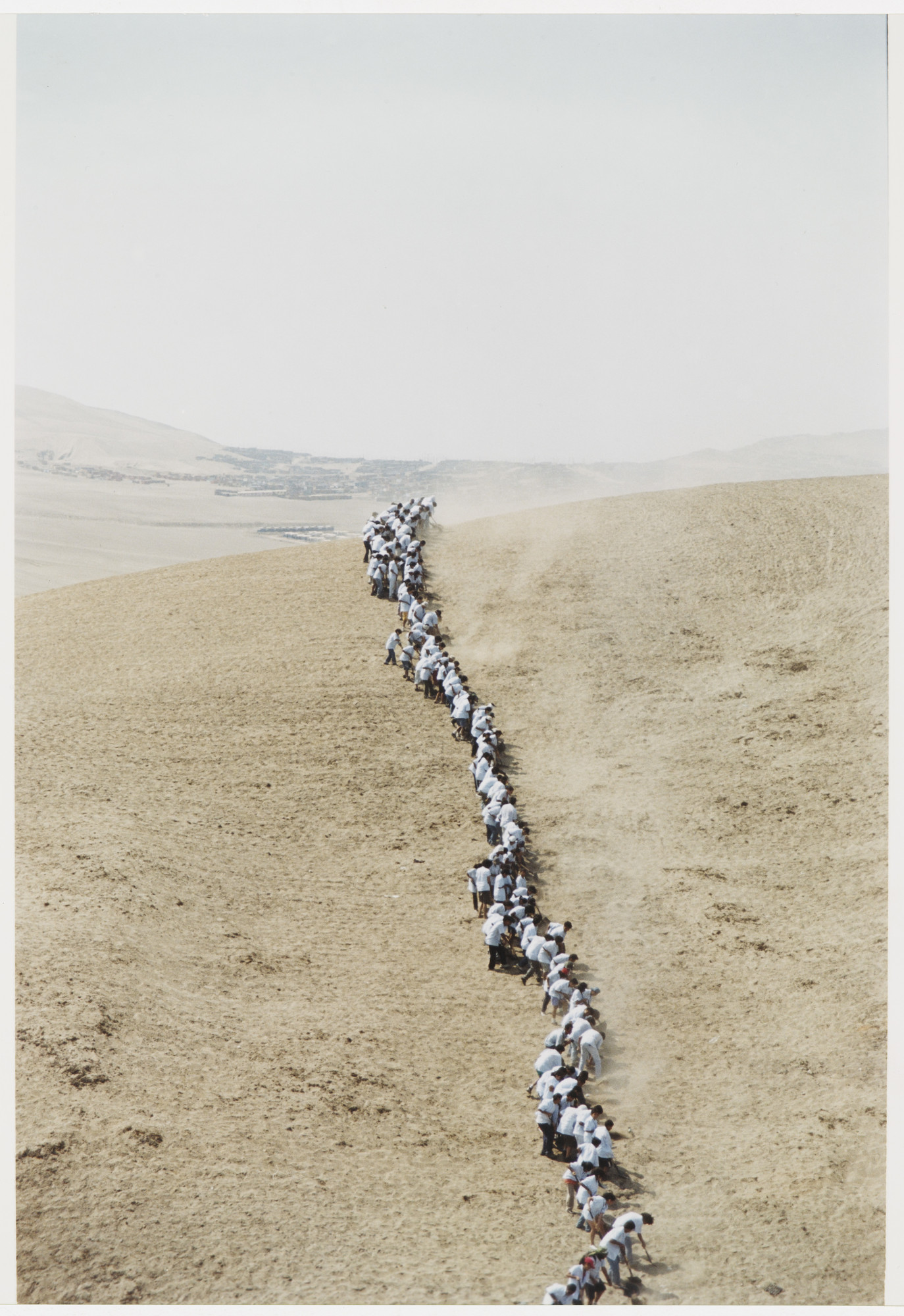 Francis Alÿs. Untitled, from When Faith Moves Mountains. 2002. Color photograph. The Museum of Modern Art, New York. Gift of The Speyer Family Foundation, Kathy and Richard S. Fuld, Jr., Marie-Josée and Henry R. Kravis, Patricia Phelps de Cisneros, Anna Marie and Robert F. Shapiro, The Julia Stoschek Foundation, Düsseldorf, and Committee on Media Funds. © 2011 Francis Alÿs