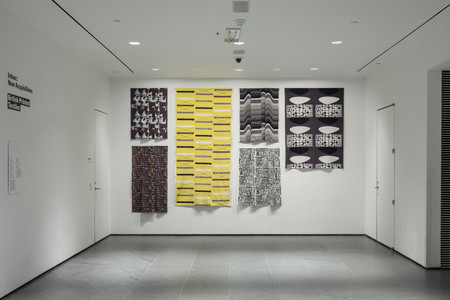 Installation view of Inbox: British Printed Textiles. From top to bottom, left to right: Marian Mahler (British, 1911–1983). Untitled. 1952–53. Screenprinted rayon, 40 1/2 × 45 1/2″ (102.9 × 115.6 cm). Manufacturer: David Whitehead Ltd. Gift of Jill A. Wiltse and H. Kirk Brown III, 2015. Lucienne Day (British, 1917–2010). Magnetic (Furnishing fabric). 1957. Roller-printed cotton, 54 × 49 1/2″ (137.2 × 125.7 cm). Manufacturer: Heal Fabrics. Lucienne Day. Mezzanine. 1958. Screenprinted cotton crepe, 95 1/2 × 48 1/4″ (242.6 × 122.6 cm). Gift of Jill A. Wiltse and H. Kirk Brown III, 2015. Barbara Brown (British, born 1932). Frequency (Furnishing fabric). 1969. Screenprinted cotton, 49 1/2 × 44 1/2″ (125.7 × 113 cm). Manufacturer: Heal Fabrics. Jill A. Wiltse and H. Kirk Brown III Collection, Gift of the Committee on Architecture &amp; Design, 2015. Eduardo Paolozzi (British, 1924–2005). Bark Cloth. c. 1954. Screenprinted cotton, 45 1/2 × 50 1/4″ (115.6 × 127.6 cm). Manufacturer: Hammer Prints Ltd. Gift of Jill A. Wiltse and H. Kirk Brown III, 2015. Victor Vasarely (French, born Hungary. 1908–1997). Kernos (Furnishing fabric). 1962. Screenprinted cotton, 70 × 47 3/4″ (177.8 × 121.3 cm). Manufacturer: Edinburgh Weavers. Gift of Jill A. Wiltse and H. Kirk Brown III, 2015. Photo: John Wronn