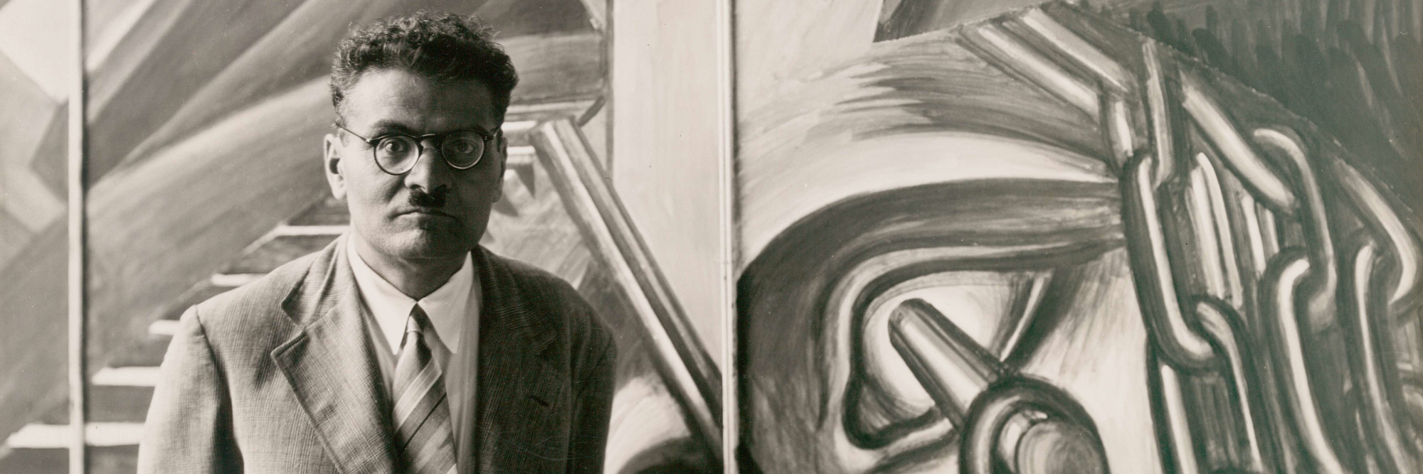 José Clemente Orozco with his fresco &#34;Dive Bomber and Tank,&#34; commissioned by MoMA during the exhibition &#34;Twenty Centuries of Mexican Art,&#34; May 15–September 30, 1940. Photographic Archive. The Museum of Modern Art Archives, New York