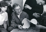 Josef Albers examining a folded paper construction with students at Black Mountain College, 1946. Photo: Genevieve Naylor