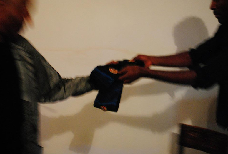 Terry Adkins and Kamau Amu Patton exchange a Lone Wolf Recital Corps sash at Third Streaming, New York, 2013