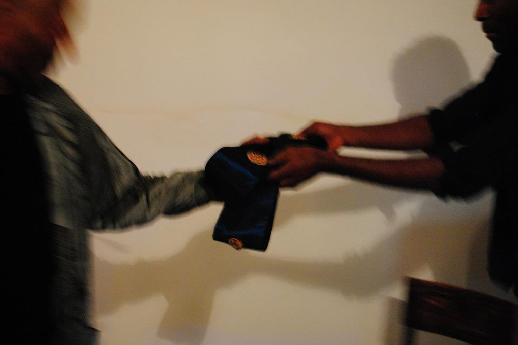 Terry Adkins and Kamau Amu Patton exchange a Lone Wolf Recital Corps sash at Third Streaming, New York, 2013