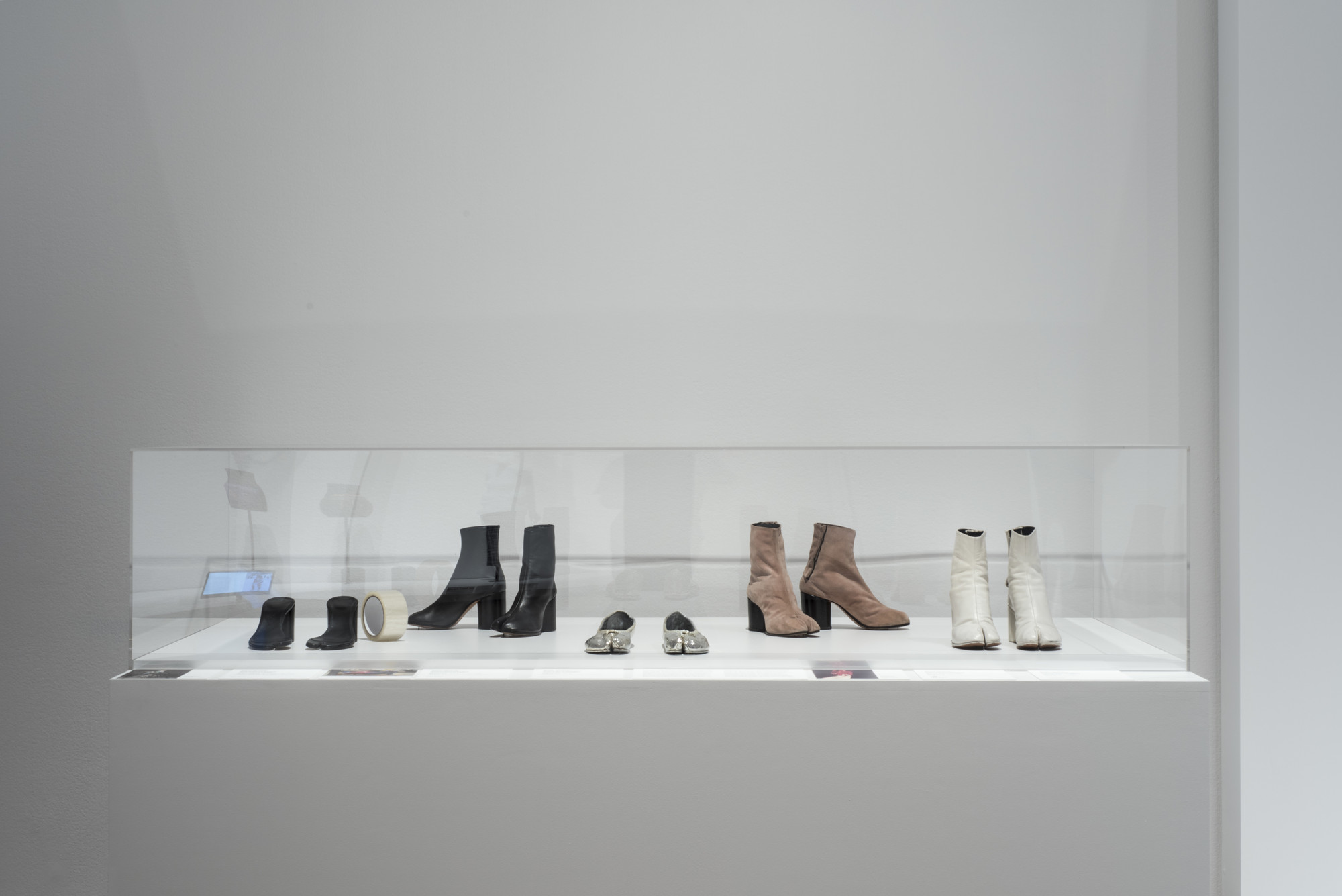 Martin Margiela (Belgian, born 1957). Maison Martin Margiela (later Maison Margiela) (France, founded 1988). Boots. 1990–99. Leather. Sandals. Spring/summer 1996. Leather and adhesive tape. Boots. Spring/summer 1989. Suede. Shoes. 2008. Leather. Fashion Museum, Province of Antwerp. Boots. c. 1990. Leather. Lent by Linda Loppa. Image taken during installation of _Items: Is Fashion Modern?_