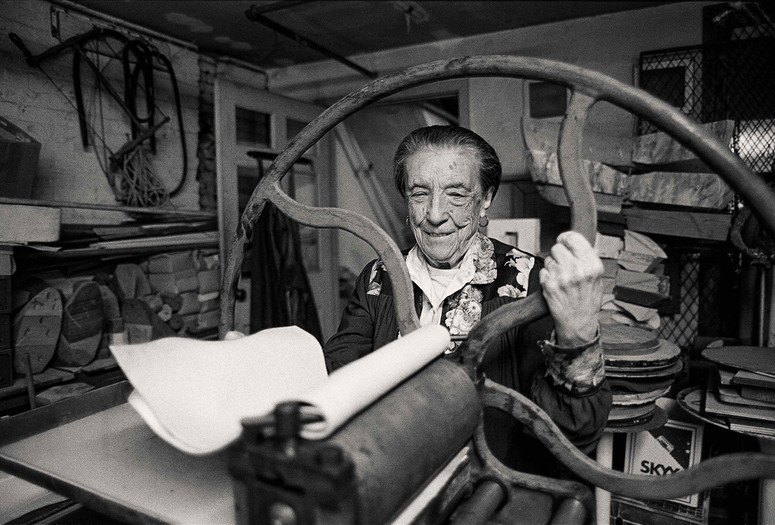 Louise Bourgeois at the printing press in the lower level of her home/studio on 20th Street, New York, 1995. Photograph: Mathias Johansson