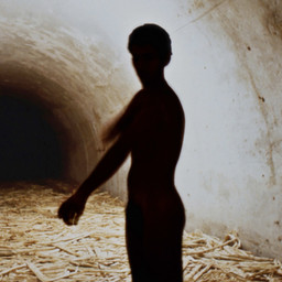 Tania Bruguera. Untitled (Havana, 2000), 2000. Sugar cane bagasse, video (black and white, silent; 4:37 min.), and live performance. Dimensions variable. The Museum of Modern Art, New York.The Modern Women's Fund and Committee on Media and Performance Art Funds. © 2018 Tania Bruguera. Installation view, Uno más cerca del otro, VII Bienal de La Habana. Fortaleza de San Carlos de la Cabaña, Galería de Contraminas de San Ambrosio, Havana (November 17, 2000). Image courtesy the artist. Photo: Casey Stoll.