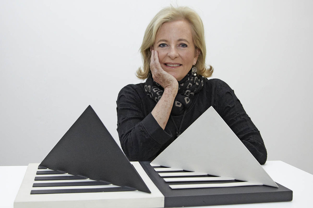 Patricia Phelps de Cisneros. Photo: Timothy Greenfield-Sanders. Artwork shown: Luiz Sacilotto. *Concretion 58*. 1958. Enamel on metal and acrylic over wood, 7 7/8 × 23 5/8 × 12" (20 × 60 × 30.5 cm). Promised gift of Patricia Phelps de Cisneros through the Latin American and Caribbean Fund in honor of Rodrigo Cisneros-Santiago
