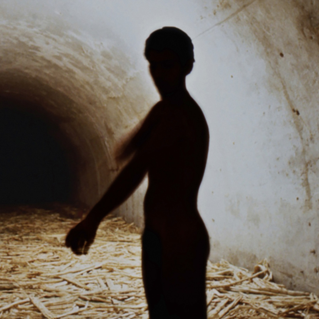 Tania Bruguera. _Untitled (Havana, 2000)_, 2000. Sugar cane bagasse, video (black and white, silent; 4:37 min.), and live performance. Dimensions variable. The Museum of Modern Art, New York.The Modern Women's Fund and Committee on Media and Performance Art Funds. © 2018 Tania Bruguera. Installation view, Uno más cerca del otro, VII Bienal de La Habana. Fortaleza de San Carlos de la Cabaña, Galería de Contraminas de San Ambrosio, Havana (November 17, 2000). Image courtesy the artist. Photo: Casey Stoll.