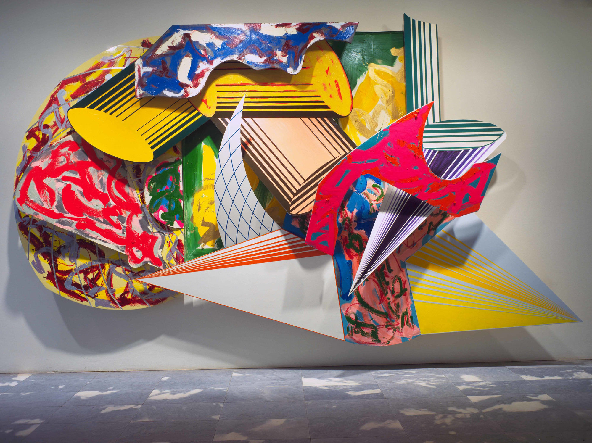 Frank Stella. <em>Giufà , la luna, i ladri e le guardie.</em> 1984. Synthetic polymer paint, oil, urethane enamel, fluorescent alkyd, and printing ink on canvas, and etched magnesium, aluminum, and fiberglass. The Museum of Modern Art, New York. Acquired through the James Thrall Soby Bequest. © 2018 Frank Stella / Artists Rights Society (ARS), New York