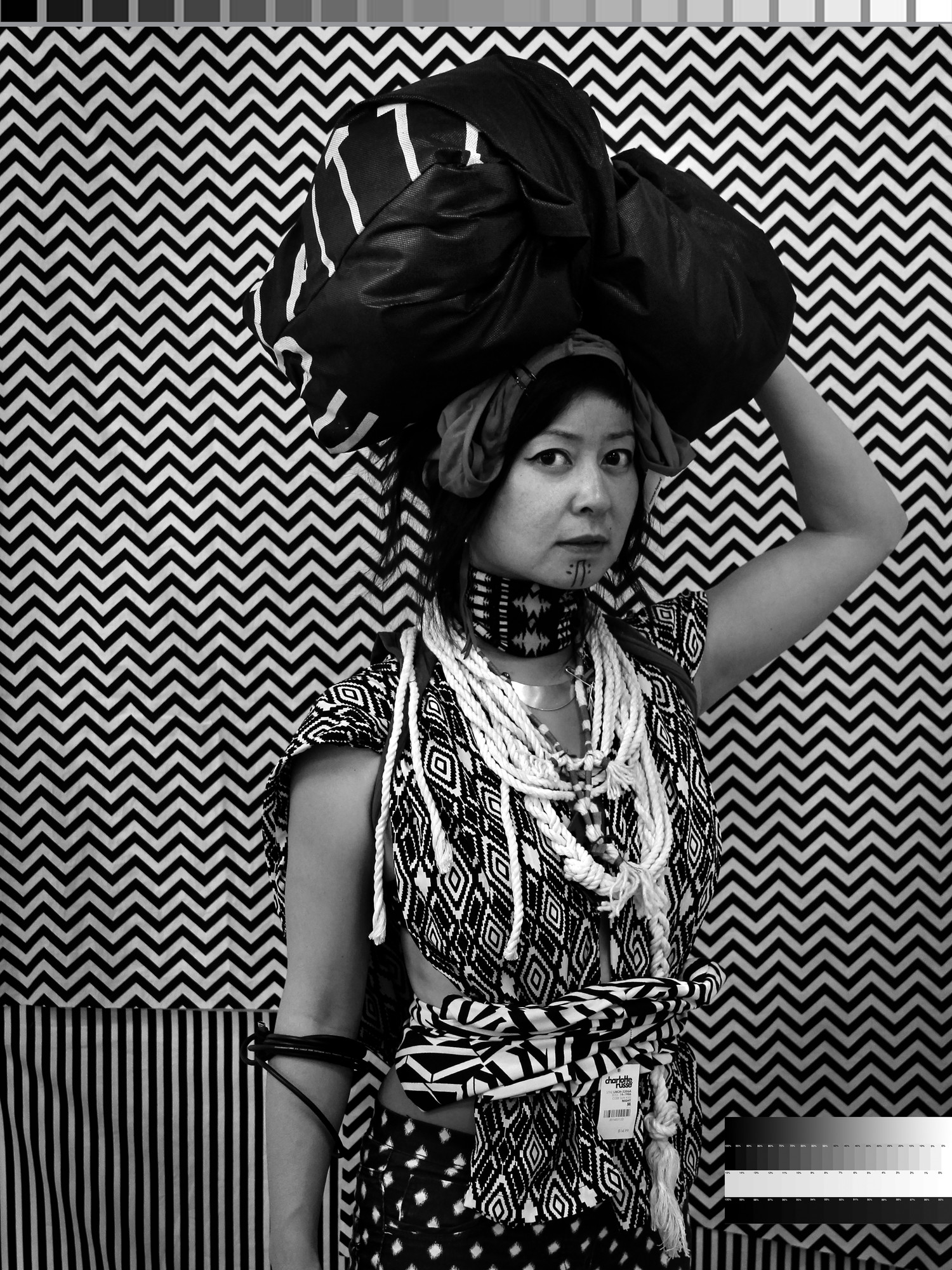 Stephanie Syjuco. _Cargo Cults: Head Bundle_. 2013-16. Pigmented inkjet print, 40 x 30 inches (101.6 x 76.2 cm). Courtesy the artist and Catharine Clark Gallery, San Francisco and Ryan Lee Gallery, New York. © 2018 Stephanie Syjuco