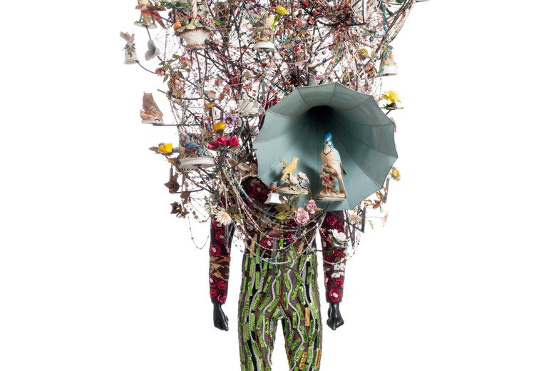 Nick Cave. Soundsuit. 2011. Found objects, knit head and bodysuit, and mannequin, 10' 1" x 42" x 33" (307.3 x 106.7 x 83.8 cm). The Museum of Modern Art, New York. Gift of Agnes Gund in honor of Dr. Stuart W. Lewis. © 2018 Nick Cave. Photo: Imaging and Visual Resources Department, MoMA